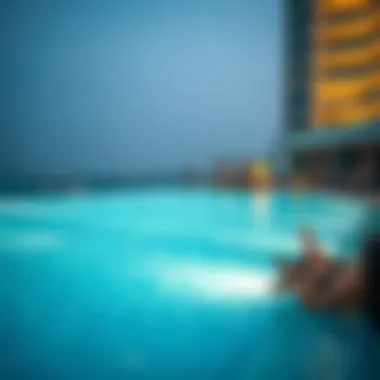 An evening scene at the Aura Sky Pool with illuminated features and guests enjoying the luxurious atmosphere