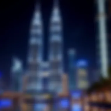 Illuminated Emirates Towers at Night Night view of Emirates Towers illuminated, reflecting their modern architectural design.