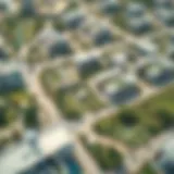 Aerial view of Masaar Living community showcasing green spaces and modern architecture